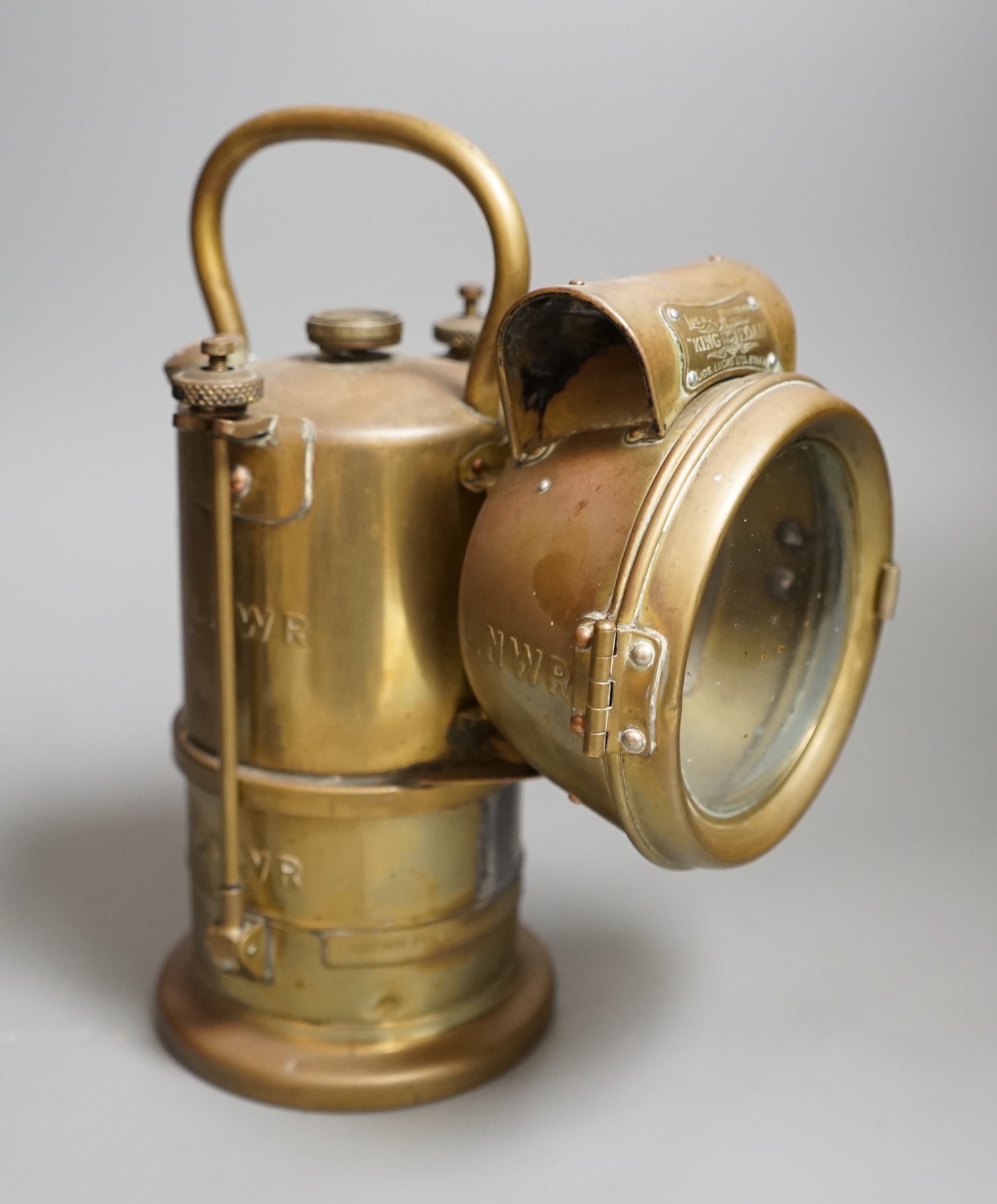 A LNWR railway inspection lamp, company ceased trading in 1922, 26cms high